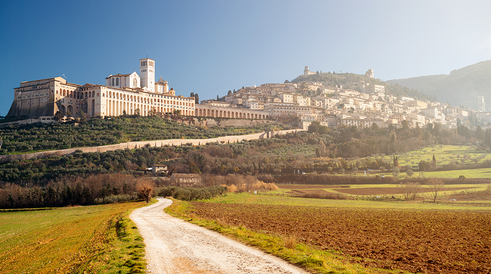 Assisi, Italy town skyline with the Basilica of Saint Francis of Assisi.